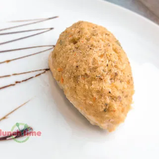 Котлета рыбная с гарниром из риса с овощами